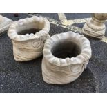 Pair of small ornamental stonework sacks