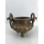 Large bronze censer with dragon-design loop-handles and three feet, approx 25cm x 15cm