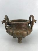 Large bronze censer with dragon-design loop-handles and three feet, approx 25cm x 15cm