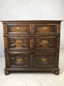 Jacobean chest of four drawers with applied carved mouldings and brass handles. Comes in two