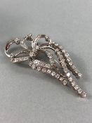 18ct White Gold Brooch in a ribbon style set with in excess of 50 diamonds