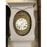 Decorative longcase clock with grey paint finish, white face with black roman numerals and flower