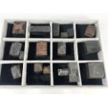 Collection of seventeen vintage copper printing blocks to include images of guns, bird cages,