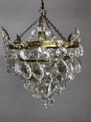 Four tier pendant light with glass drops, approx 29cm in diameter and with a 23cm drop