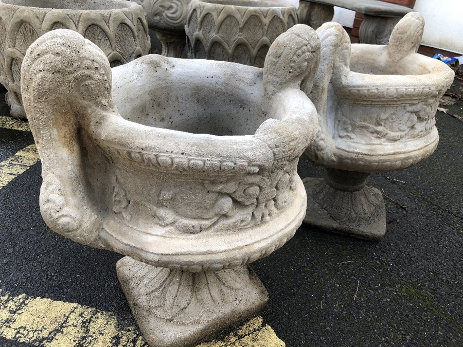 Two swan neck garden planters