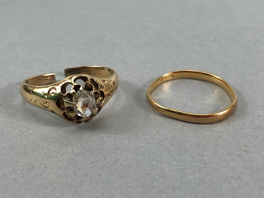 Two Gold rings A/F. A gold band hallmarks rubbed approx 1.4g & unhallmarked Gold ring with a