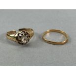 Two Gold rings A/F. A gold band hallmarks rubbed approx 1.4g & unhallmarked Gold ring with a