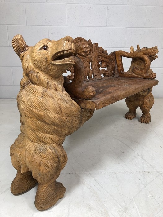 A Black forest style low bench, with two bears flanking a carved back and solid seat, approx 120cm x - Image 7 of 12