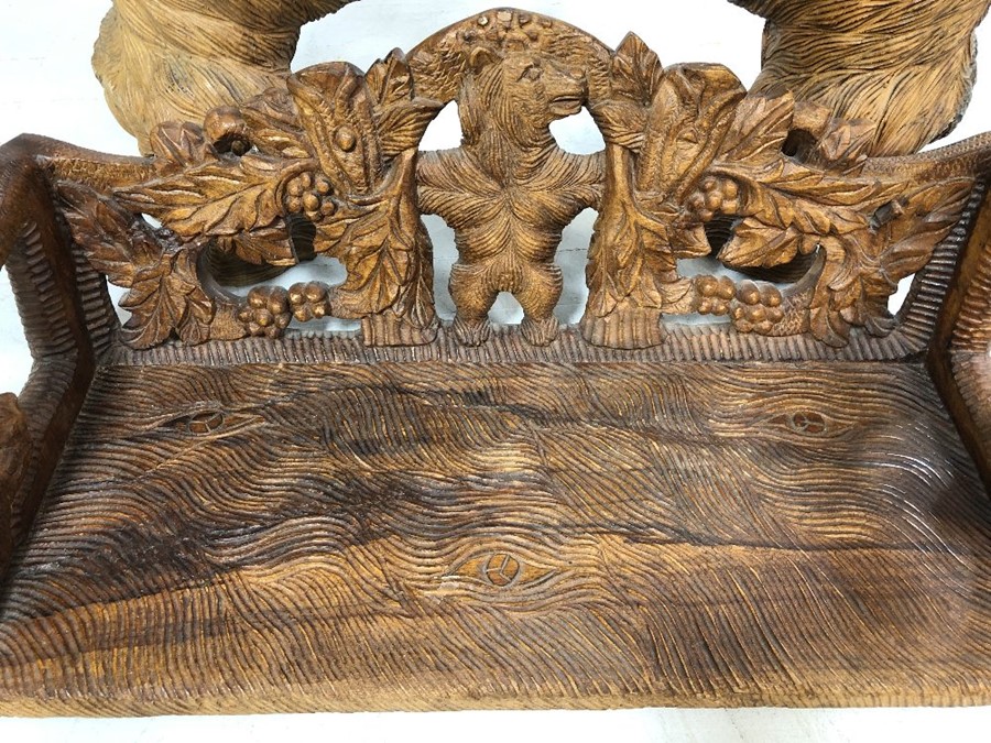A Black forest style low bench, with two bears flanking a carved back and solid seat, approx 120cm x - Image 11 of 12