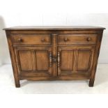 Ercol sideboard with two drawers and cupboards under. Ercol blue label to inner door
