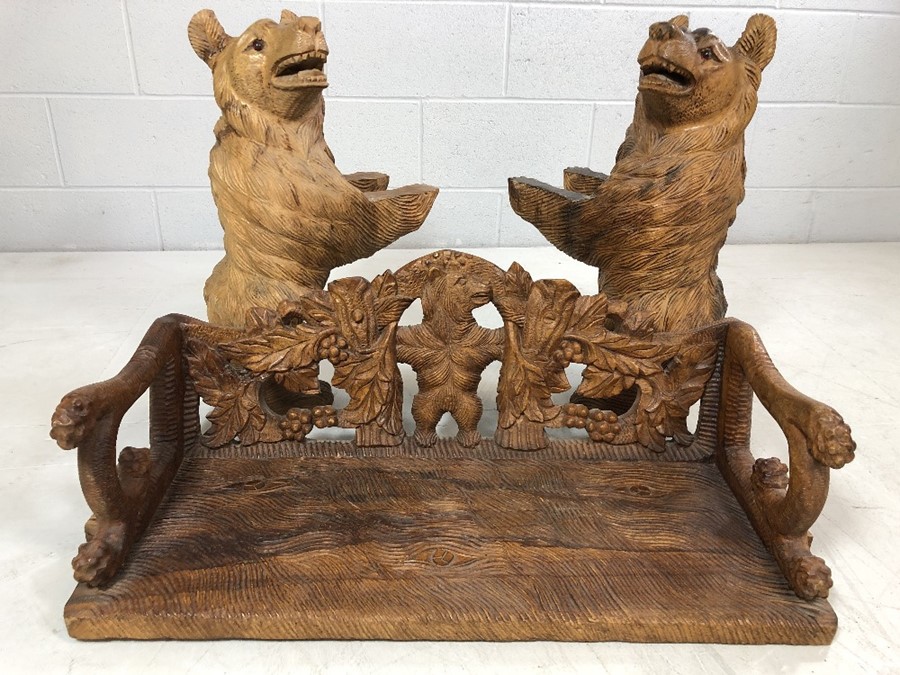 A Black forest style low bench, with two bears flanking a carved back and solid seat, approx 120cm x - Image 10 of 12