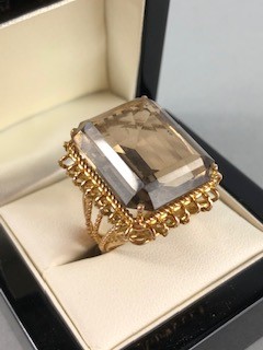 Wire work unmarked Gold ring set with a single large Emerald cut pale yellow Citrine approx.