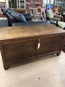 Large coffer with panelling, approx 126cm x 59cm x 59cm tall, with key