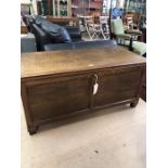 Large coffer with panelling, approx 126cm x 59cm x 59cm tall, with key