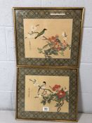 Pair of Japanese silk prints depicting birds on blossom branches, approx 42cm x 37cm
