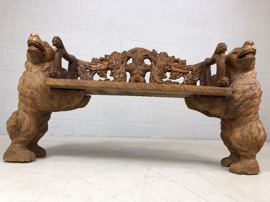 A Black forest style low bench, with two bears flanking a carved back and solid seat, approx 120cm x - Image 6 of 12