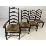 Four rush-seated ladder back chairs to include one carver