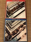 2 The Beatles LPs including "1962-1966" red vinyl and "1967-1970" blue vinyl.