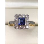 18ct Gold and Platinum ring with Blue central stone and diamonds