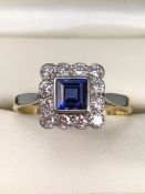 18ct Gold and Platinum ring with Blue central stone and diamonds