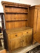 Large Pine dresser of two cupboards, two drawers and shelves over
