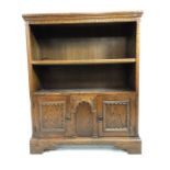 Freestanding bookshelf with two cupboards under, approx 84cm x 26cm x 103cm tall