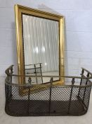 Modern gold framed bevel edged mirror approx 77cms x 54cms. Along with a small brass and metal