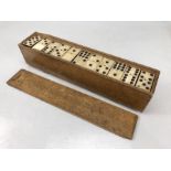 Set of vintage dominoes in wooden case