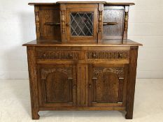Sideboard / buffet with cupboard and two drawers under and central cupboard over with glazed door by