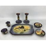 Watcombe Torquay pottery dressing table set on purple ground with cottage design, seven pieces