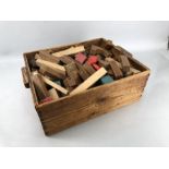 Collection of children's vintage toy building blocks in wooden crate