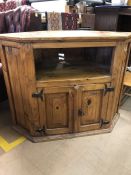 Pine television unit with shelf and cupboard under. Approx 107cms wide x 82cm tall