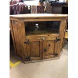 Pine television unit with shelf and cupboard under. Approx 107cms wide x 82cm tall
