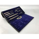 Technical drawing set in black case with blue velvet lining, one compartment vacant