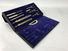 Technical drawing set in black case with blue velvet lining, one compartment vacant