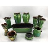 Collection of green Watcombe Torquay pottery to include a pair of green lustre vases, incised