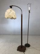 Brass standard lamp and a turned wooden standard lamp