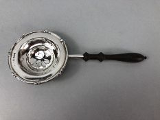 Pierced Silver Hallmarked tea strainer by Thomas Bradbury & Sons Ltd with turned wooden handle