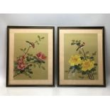 Pair of Chinese silk paintings on green silk depicting Flowers and Birds