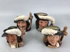 Four Royal Doulton character jugs, The Three Musketeers, Porthos, Aramis and Athos, and D'