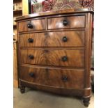 Bow fronted chest of five drawers with ebonised handles on turned feet approx 116cm x 55cm x 123cm