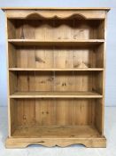 Pine bookshelf with four shelves, approx 93cm x 25cm x 123cm tall