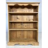 Pine bookshelf with four shelves, approx 93cm x 25cm x 123cm tall