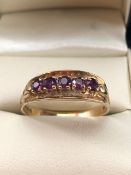 9ct Gold ring set with five Amethyst on claw settings