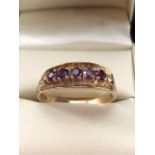 9ct Gold ring set with five Amethyst on claw settings