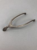 Edwardian Silver hallmarked pincers /sugar nips in the form of a wishbone with sprung hinge