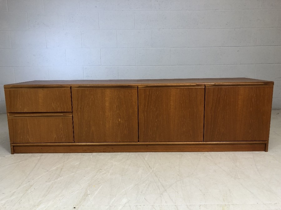 Mid century low sideboard with three door cupboard and two drawers, approx 183cm x 48cm x 50cm tall