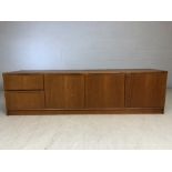 Mid century low sideboard with three door cupboard and two drawers, approx 183cm x 48cm x 50cm tall