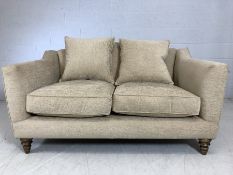 John Lewis two-seater cream upholstered sofa, approx 150cm x 100cm x 83cm tall at back