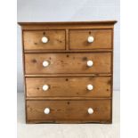 Antique pine chest of five drawers with ceramic handles. Approx 96cms x 48cms x 104cm tall